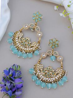 Statement earrings for a statement look! These handmade high quality kundan polki and meenakari earrings in stunning pastel blue and gold are a unique addition to your outfit to glam it up! These can be paired with both Indian and western outfits. They are also extremely lightweight because they are handcrafted. Easy on your ears and beautiful for the eyes 💖 For any queries, please reach out to us. Happy shopping! Bohemian Round Chandbalis For Wedding, Bohemian Chandbalis For Wedding, Bohemian Style Round Chandbalis For Weddings, Navratri Bridal Chandbali Earrings For Party, Chandbalis With Stone Work For Navratri, Stone Work Chandbalis For Navratri, Navratri Chandbalis With Stone Work, Bohemian Chandbali Chandelier Earrings For Wedding, Bohemian Chandbalis For Festive Wedding