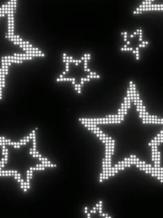 an array of pixelated stars on a black background