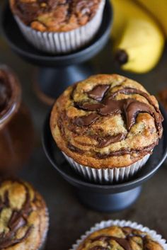 nutella banana swirl muffins with chocolate drizzled in the middle