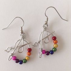 These earrings are a great gift for artists and art teachers. Beads are called Miracle Beads. Wire is non-tarnish aluminum. Surgical steel earring hooks are hypo-allergenic. I have been making custom wire art and jewelry for 30 years. I started in 1989 selling jewelry on the streets of Montreal. Over the years I have participated in many craft shows, exhibitions and sold my work in gallery shops across Canada including the National Gallery of Canada. My husband and I specialize in custom wedding Artsy Nickel-free Dangle Hoop Earrings, Artsy Wire Wrapped Earrings Gift, Artsy Earrings With Round Beads And Ear Wire, Adjustable Artsy Nickel-free Hoop Earrings, Artsy Adjustable Hypoallergenic Jewelry, Artsy Beaded Earrings For Pierced Ears As Gift, Adjustable Nickel-free Artsy Beaded Earrings, Artsy Adjustable Nickel-free Beaded Earrings, Adjustable Nickel-free Beaded Artsy Earrings