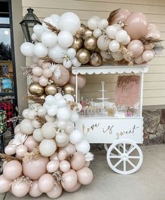 a small cart with balloons on it