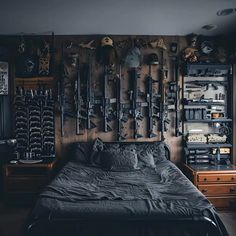 a bed with lots of tools hanging on the wall