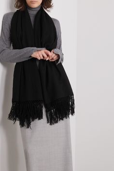 The Row’s ‘Alala’ scarf is made from a wool and cashmere-blend that's cozy, soft and will go with nearly anything. It's minimally designed with fringed edges and has a wide shape that can be knotted at the neck or secured beneath a belt when draped over the shoulders. Wednesday Studios Scarf, Black Tassel Scarf, Black Oversized Scarf, White Cashmere Scarf, Hooded Scarf, Womens Cashmere, Fringe Scarf, Black Fringe, Fall Shopping