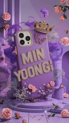 an iphone case with the words'min young'written on it in front of pink roses