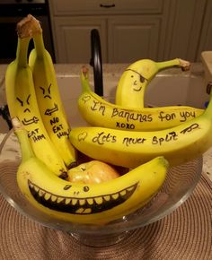 bananas with faces drawn on them sitting in a bowl