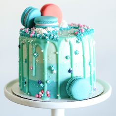 there is a blue cake with icing on the top and frosting on the bottom