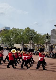 a group of men in uniform marching down a street