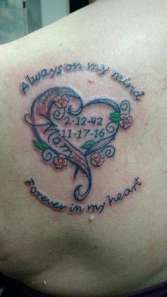 a woman with a tattoo on her back that says always in my heart, and the words