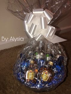 a gift basket filled with bottles of alcohol