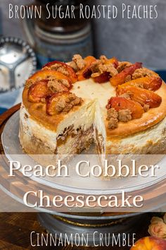 a close up of a cake on a plate with the words peach cobbler cheesecake