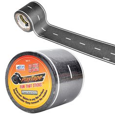 a roll of duct tape next to a canister on the side of a road