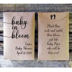 two baby in bloom tags on wooden boards