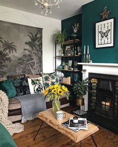 a living room filled with furniture and a fire place in front of a painting on the wall