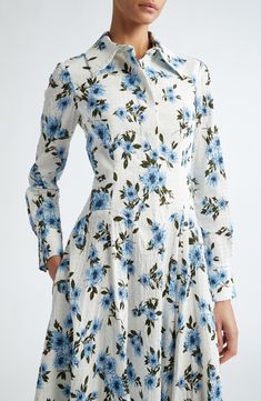 The London-based designer offers a romantic take on the classic shirtdress with this long-sleeve midi cut from clip-dot seersucker patterned in vibrant dahlias. 49" length (size 18UK) Hidden-button half placket Spread collar Long sleeves with button cuffs On-seam pockets Lined, except sleeves 98% cotton, 2% elastane Dry clean Made in the UK Designer Clothing Fitted Long Sleeve Midi Dress With Covered Buttons, Classic Long Sleeve Spring Dresses, Classic Spring Dress With Covered Buttons, Classic Spring Dresses With Covered Buttons, Classic Midi Dress For Spring Brunch, Spring Formal Midi Dress With Covered Buttons, Spring White Dresses With Spread Collar, Spring Long Sleeve Midi Dress With Covered Buttons, Classic Spring Midi Dress For Garden Party