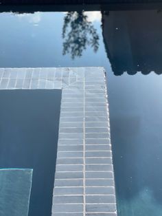 the reflection of a building in water