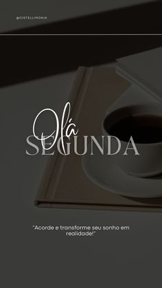 a coffee cup sitting on top of a book next to a pen and paper with the words la segunda written in spanish