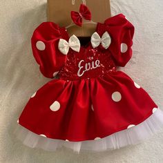 a red dress with white polka dots on it and a bow at the top that says love