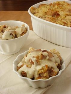 two bowls filled with food sitting on top of a table