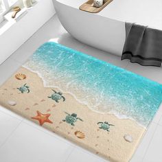 a bathroom rug with sea turtles and starfish on the beach in front of a bathtub