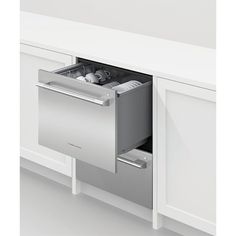 an open dishwasher drawer in a kitchen