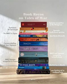 a stack of books sitting on top of a wooden table