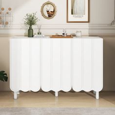 a white cabinet sitting in the middle of a room