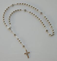 "This beautiful silver tone alloy rosary is imported from Italy. Perfect rosary for First Communion and suitable for boys or girls. LENGTH: 15\" MATERIAL: Silver tone alloy BEADS: 1/8\" round beads (approx. 3 mm) CRUCIFIX: Silver tone alloy crucifix measures 1-1/8\" x 3/4\" Can be fit over the head with the lobster clasp included. This is a very good quality and elegant rosary that you can be proud to show to your friends. To prevent from getting damaged it's a good idea to preserve your rosary Silver Rosary, Bracelets Patterns, The Lobster, Diy Bracelets Patterns, Be Fit, Wire Work Jewelry, Work Jewelry, Holy Communion, Prayer Beads