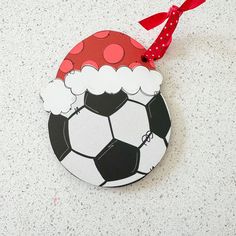 a christmas ornament with a soccer ball on it