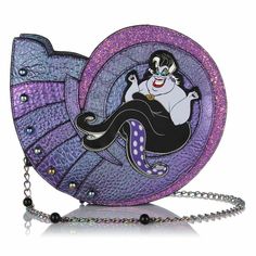 a purple and blue purse with an evil queen sitting on it's back legs