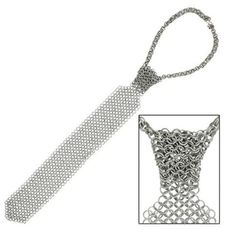 PRICES MAY VARY. Chainmail tie made specifically for a woman – or a boy. If you look at the photos very carefully, you can see that the chainmail is shaped like a regular tie; however, there is no need to actually tie this tie! Instead, there is a small hole which allows the wearer to insert one end into the tie and thread it through Tie measures 40 inches long and weighs 103 grams Delightfully subtle, it turns any outfit into a hard rock masterpiece! Small horizontal chain that keeps the thread Chainmail Clothing, Chainmail Shirt, Chainmail Armor, Medieval Accessories, Windsor Knot, Spilled Wine, Board Room, Inner Warrior, Tie Gifts