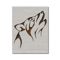 a painting of a wolf's head on a white wall with wood planks