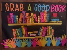 a sign that says grab a good book with handprints and bookshelves