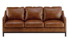 a brown leather couch sitting on top of a wooden frame