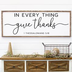 a sign that says in every thing give thanks on the side of a white dresser