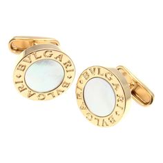 About This Piece:  Metal: 18k Yellow Gold  Measurements: 17mm x 18mm x 20mm  Weight: 19.3 grams  Stones: 2 round mother of pearl stones 11mm each  Hallmarks: Bulgari 750 Luxury Gold Cufflinks With Polished Finish, Luxury Designer Round Cufflinks, Luxury 14k Gold Hallmarked Cufflinks, Luxury Hallmarked Yellow Gold Cufflinks, Mother Of Pearl Cufflinks, Diamond Cufflink, Pearl Cufflinks, Gold Cufflinks, Georg Jensen