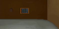 an empty room with a small window and bars on the wall, in front of it