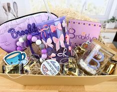 a box filled with assorted items on top of a wooden table