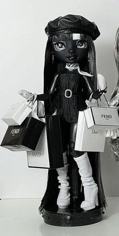 two dolls are holding shopping bags and looking at the same person's purses