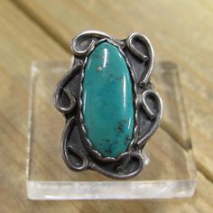 Lovely vintage sterling silver turquoise ring. Whole face of ring measures 24 mm tall and 23 mm wide. Turquoise stone measures 20 mm tall and 10 mm wide. Width of the band is 3 mm. Ring size is 4.25, we can size most rings for an additional fee, please message me what size you need and I will get back to you with a price. This is a beautiful blue turquoise and silver ring! Thank you for stopping by my shop! % Antique Turquoise Sterling Silver Ring, Vintage Sterling Silver Turquoise Ring With Large Stone, Vintage Sterling Silver Hallmarked Turquoise Ring, Vintage Adjustable Nickel-free Turquoise Ring, Elegant Multi-stone Turquoise Ring In Sterling Silver, Turquoise Statement Ring, Silver Turquoise Ring, Sterling Silver Multi-stone Turquoise Ring Gift, Sterling Silver Rings Turquoise