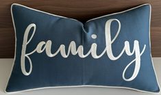 a blue pillow with the word family on it