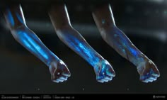 three hands with glowing blue paint on them