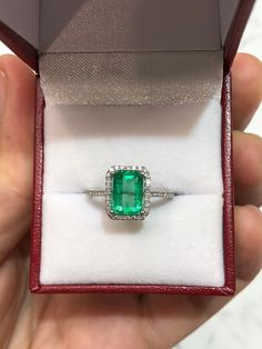 Featured is a stunning 2.31tcw natural Colombian emerald and diamond halo engagement ring. The center gemstone is a fine, bright green, Muzo emerald handset in a 14K white gold prong setting. The emerald has a medium-green color that is recognized only in Colombian emeralds; This natural gemstone has excellent luster and eye clarity. Micro pave diamonds are placed delicately in the halo setting and mid-way down the shank. The diamonds are beautifully faceted and clean to the eye. Setting Style: Solitaire Engagement Ring Emerald, Emerald Halo Engagement Ring, Emerald Ring Design, Emerald Solitaire Engagement Ring, Green Engagement Rings, Emerald Solitaire Ring, Emerald Engagement Ring Green, Halo Engagement Ring Emerald, Colombian Emerald Ring