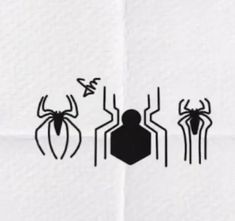 three black and white spider silhouettes are shown on a piece of paper with the word,