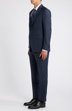 Navy wool brings polish and distinction to a suit that's tailored with traditional detailing and styled to make a versatile addition to any formal wardrobe. 31" length (size 54EU) Jacket has notched lapels; chest pocket; flap pockets; interior pockets; side vents Cuff buttons may not be attached. Jackets purchased at full price can have the sleeve length customized for free at your local Nordstrom Trousers have zip fly; slant pockets; back button-welt pockets Jacket is lined 100% wool Dry clean Three-piece Suit With Notch Lapel For Semi-formal Events, Slim Fit Three-piece Suit With Notch Lapel, Tailored Three-piece Suit For Semi-formal Occasions, Tailored Three-piece Suit For Semi-formal Events, Business Three-piece Suit With Single Button, Semi-formal Slim Fit Three-piece Suit With Welt Pockets, Business Casual Three-piece Suit With Notch Lapel, Bespoke Tailored Suits With Hidden Button Closure, Formal Custom Fit Three-piece Suit With Notch Lapel