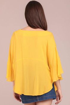 Ruffle poncho sleeves Poncho top with side tie and V-neck Materials: 100% Cotton Color: Yellow Model is 5'8" and wearing a Small Casual Tops With Kimono Sleeves For Fall, Casual Fall Tops With Kimono Sleeves, Oversized V-neck Poncho For Spring, Spring Chic Poncho With Batwing Sleeves, Chic Spring Poncho With Batwing Sleeves, Spring Bell Sleeve Tops With Tie Sleeves, V-neck Tops With Tie Sleeves For Brunch, V-neck Top With Tie Sleeves For Brunch, Chic Fall Tops With Kimono Sleeves