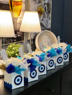 the table is decorated with blue and white gift boxes