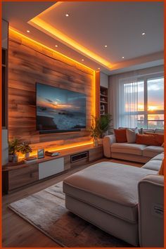 a living room with couches and a flat screen tv mounted on the wall above it