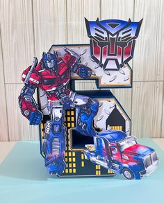 a birthday card with an image of a transformer car and a truck on it