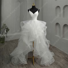 a white wedding dress on a mannequin