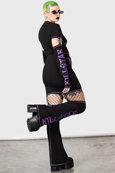 MARTYR.- Soft, stretch cotton.- Statement, printed design.- Text reads 'Wicked'.- Detatchable flared leg warmers.- Contrast purple stitching.- Fitted.Model is 5ft 6 and wears a size M.With KILLSTAR branding, 94% Cotton, 6% Elastane. Gothic Stretch Cotton Bottoms, Gothic Fitted Cotton Bottoms, Fitted Gothic Cotton Bottoms, Fitted Edgy Purple Bottoms, Edgy Fitted Purple Bottoms, Y2k Style Fitted Leg Warmers, Fitted Purple Hip-length Bottoms, Y2k Stretch Bottoms For Alternative Fashion, Purple Stretch Bottoms For Fall